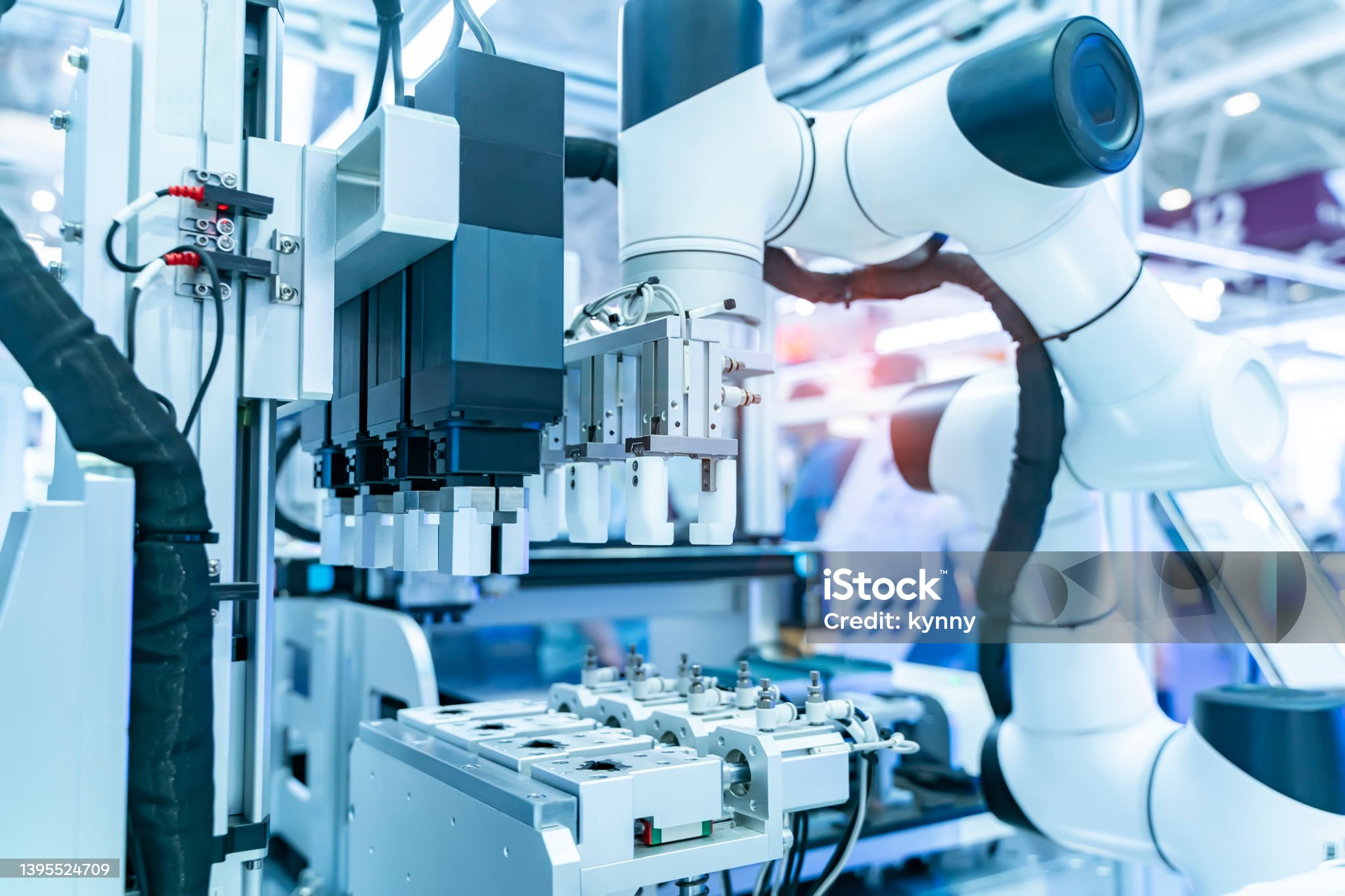 Robotic arm handling a test tube for virus sampling in a medical laboratory